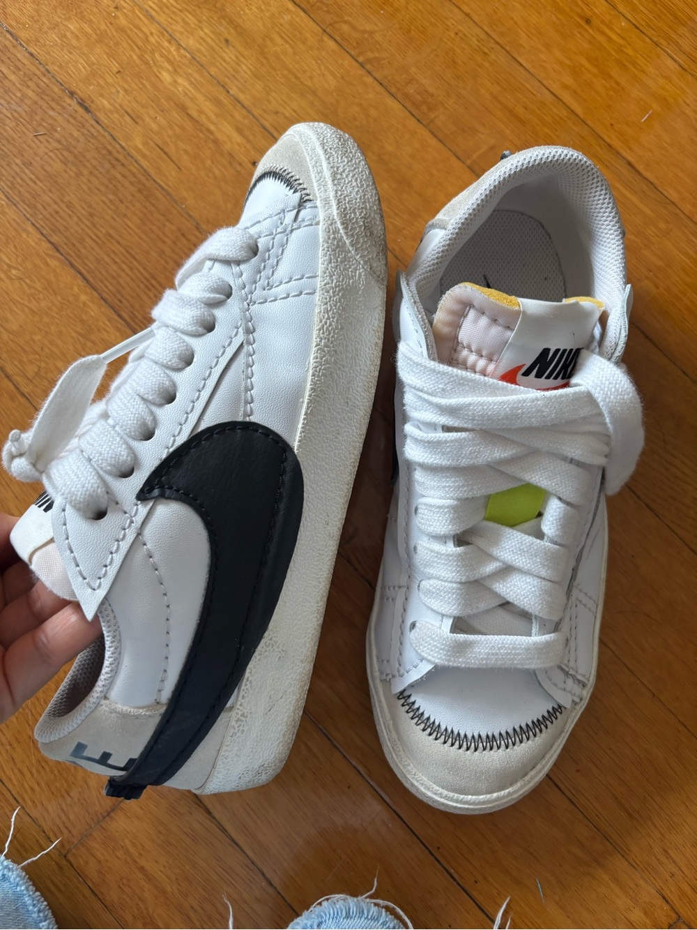 Nike women’s White Sneakers with Black Swoosh and Yellow Accent